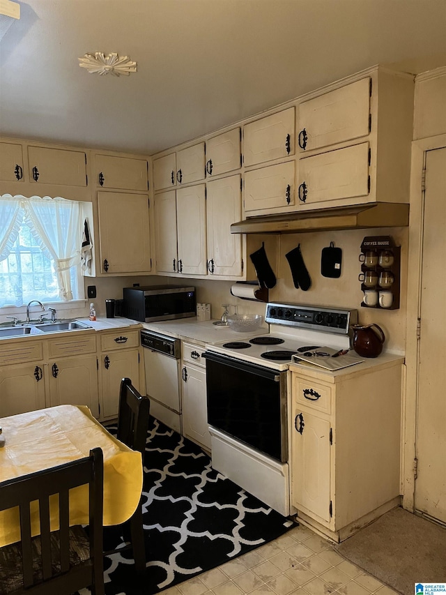 kitchen with white appliances and sink