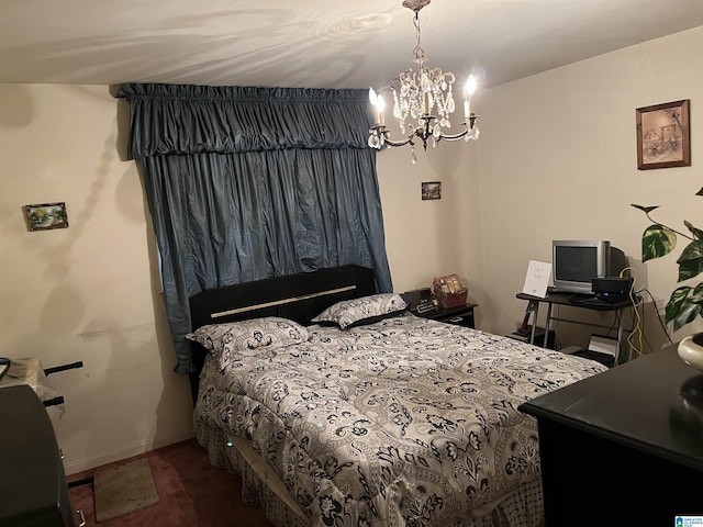 bedroom featuring a notable chandelier