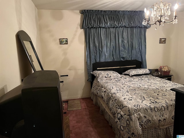 carpeted bedroom with a chandelier