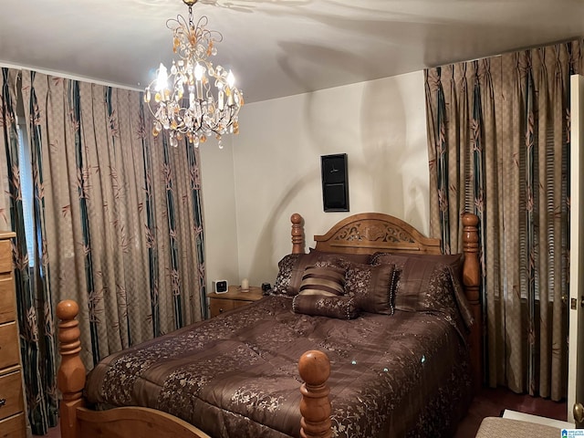 bedroom with a notable chandelier