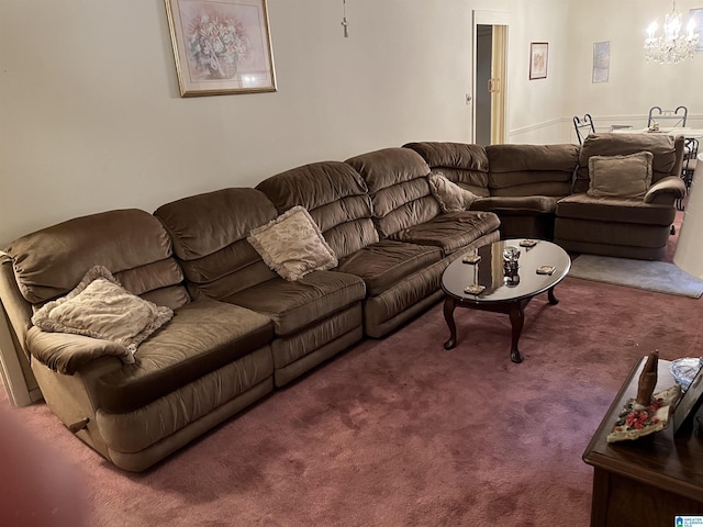 living room featuring dark carpet and an inviting chandelier