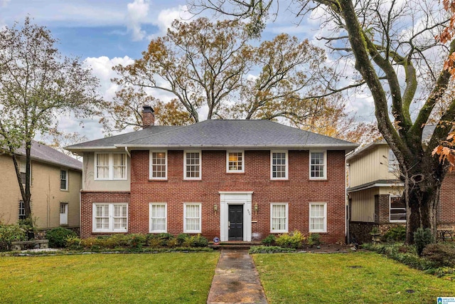 view of front of home with a front lawn