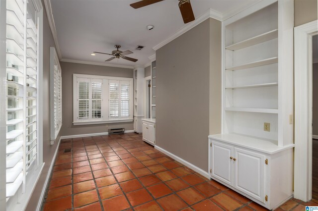 interior space featuring tile patterned floors, built in features, ceiling fan, and ornamental molding