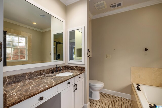 bathroom with vanity, tile patterned floors, toilet, ornamental molding, and a tub to relax in