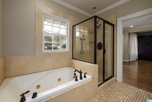 bathroom with separate shower and tub, ornamental molding, and hardwood / wood-style flooring