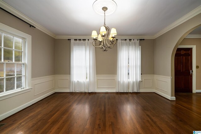 unfurnished room with a chandelier, dark hardwood / wood-style flooring, and plenty of natural light