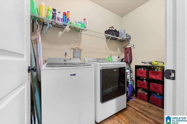 washroom with wood-type flooring and washing machine and clothes dryer