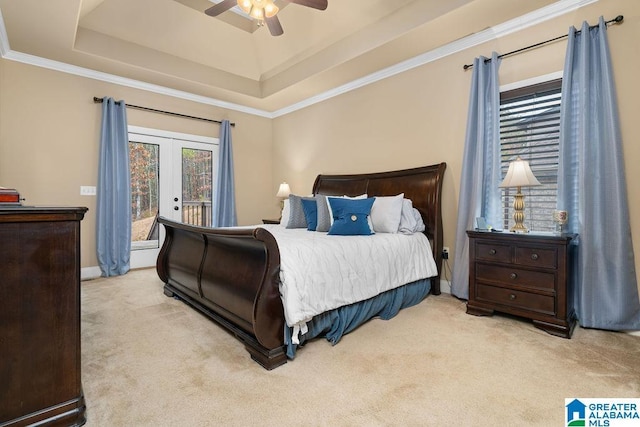 bedroom featuring ceiling fan, a raised ceiling, light colored carpet, access to outside, and ornamental molding