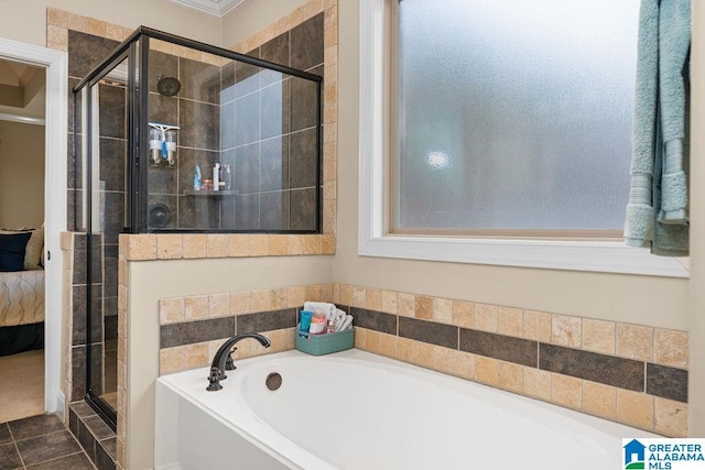 bathroom featuring tile patterned floors, crown molding, and independent shower and bath