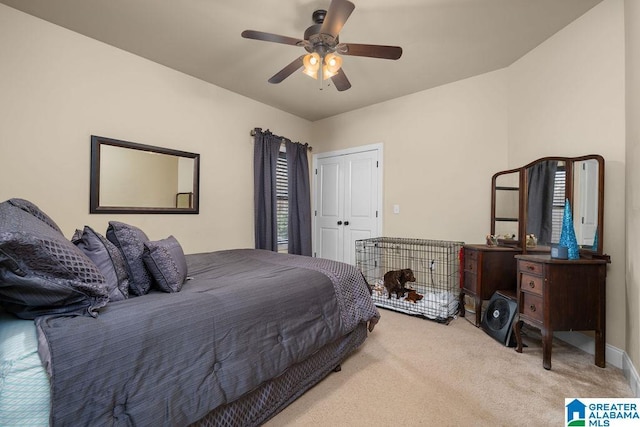 carpeted bedroom with a closet and ceiling fan