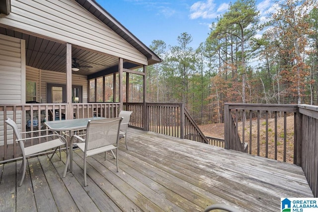 wooden terrace featuring ceiling fan