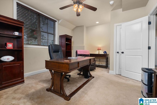 carpeted home office with ceiling fan