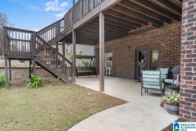 view of patio with a wooden deck and french doors