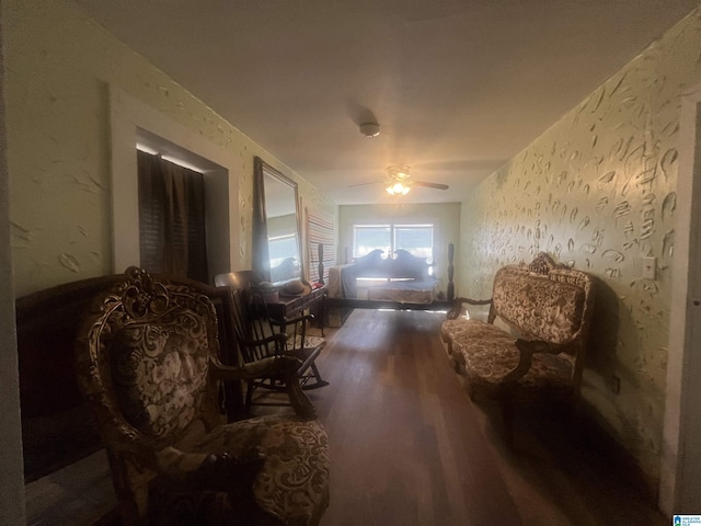 sitting room featuring hardwood / wood-style flooring and ceiling fan