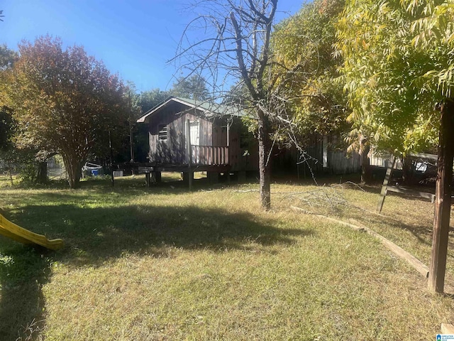 view of yard featuring a wooden deck