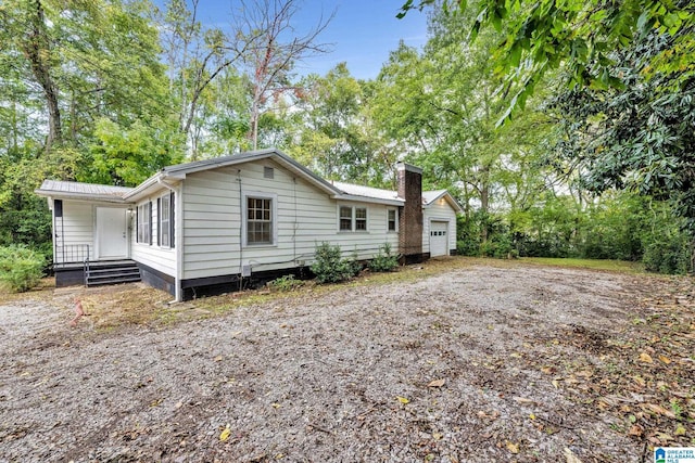 exterior space featuring covered porch and a garage