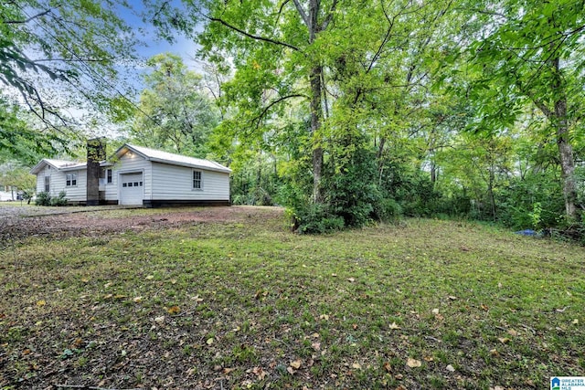 view of yard with a garage