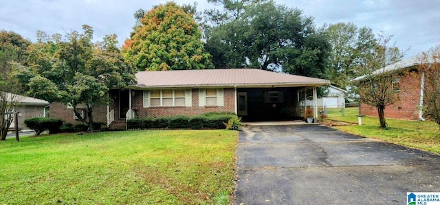 single story home featuring a front lawn and a carport