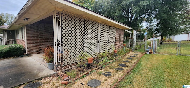 view of side of property with a yard