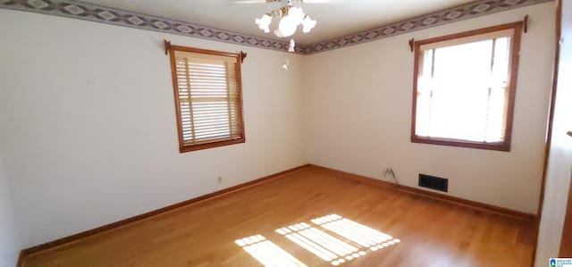 empty room featuring hardwood / wood-style floors