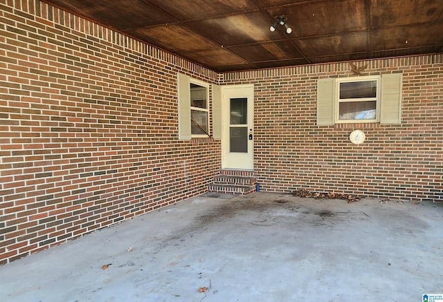 property entrance featuring a patio area