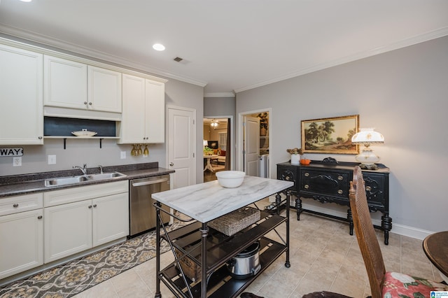 kitchen featuring sink, white cabinets, stainless steel dishwasher, and ornamental molding