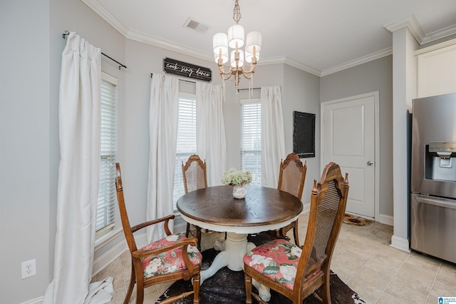 dining room featuring light tile patterned flooring, ornamental molding, and a chandelier