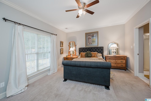 carpeted bedroom with ceiling fan and ornamental molding