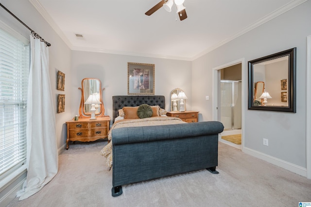 carpeted bedroom with ceiling fan, ornamental molding, and ensuite bathroom