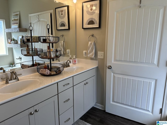 bathroom featuring hardwood / wood-style floors and vanity