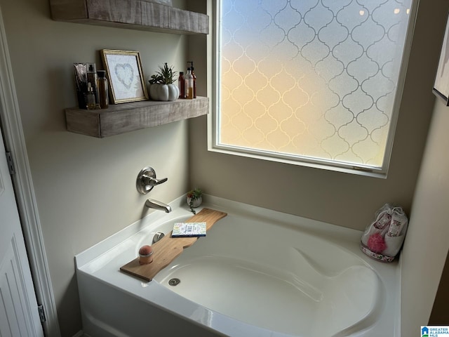 bathroom featuring a washtub