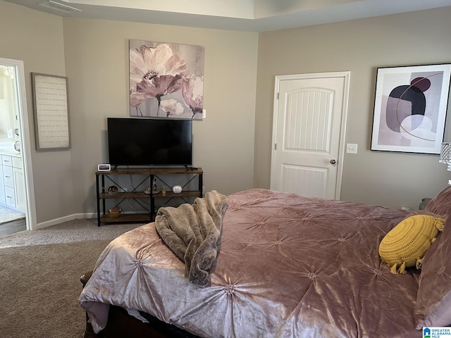 carpeted bedroom with ensuite bathroom