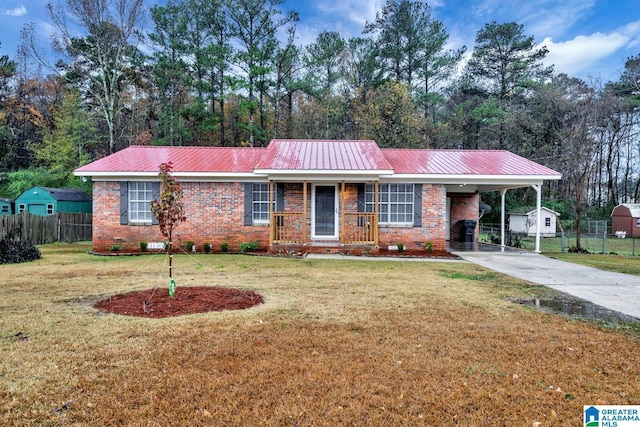 ranch-style home featuring a front yard and a carport