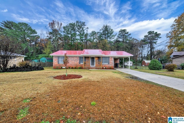 single story home with a front lawn and a carport