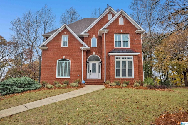 front facade featuring a front lawn