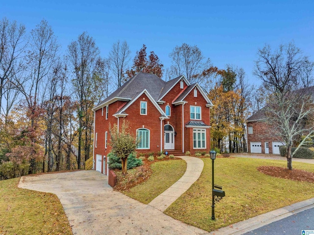 view of front facade with a garage and a front lawn