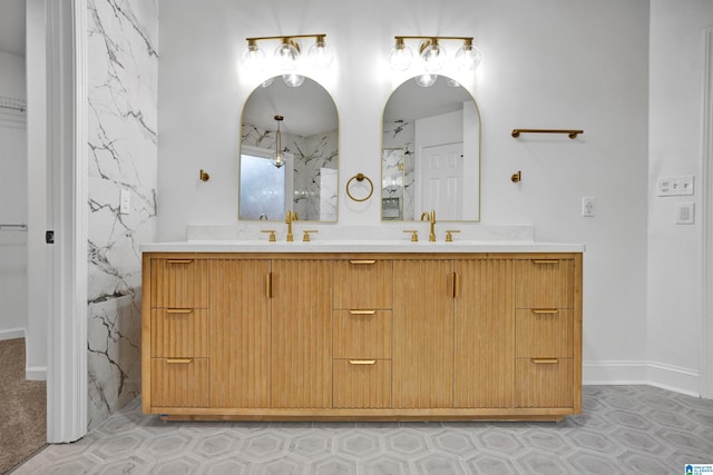 bathroom with vanity and a shower