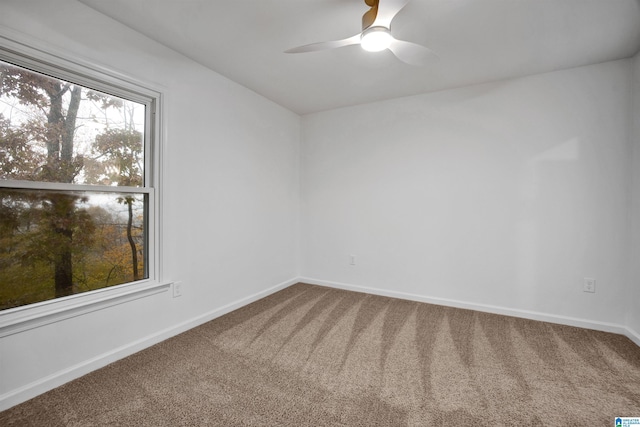 unfurnished room featuring carpet flooring and ceiling fan