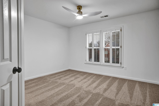 empty room with carpet and ceiling fan