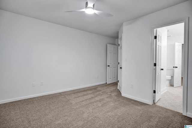 unfurnished bedroom with light carpet, ensuite bath, and ceiling fan