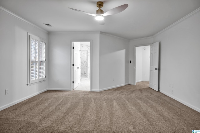 spare room with ceiling fan, carpet floors, and ornamental molding