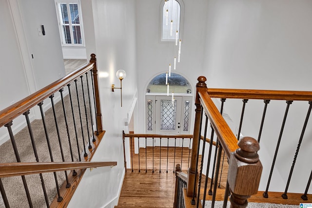 stairs with hardwood / wood-style floors