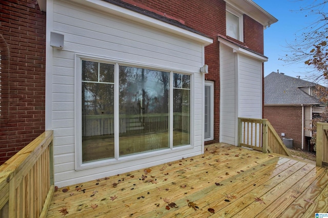 wooden terrace featuring central AC unit