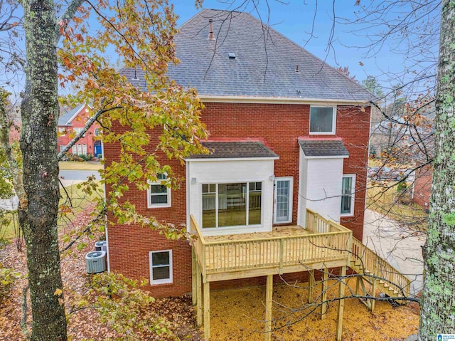 back of property with a wooden deck