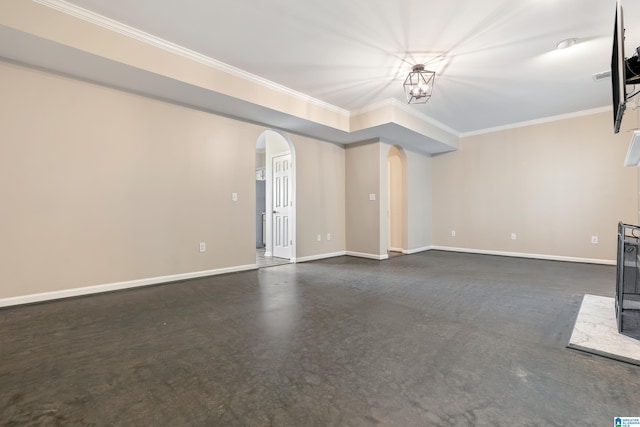 unfurnished living room featuring an inviting chandelier and ornamental molding