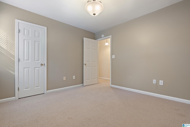 unfurnished bedroom with light carpet