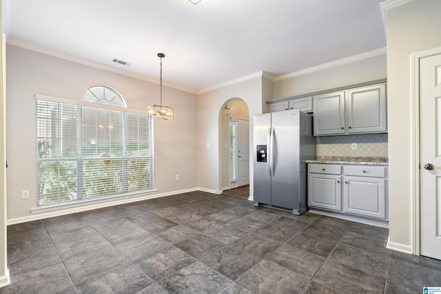 kitchen featuring gray cabinets, decorative backsplash, a healthy amount of sunlight, and stainless steel refrigerator with ice dispenser