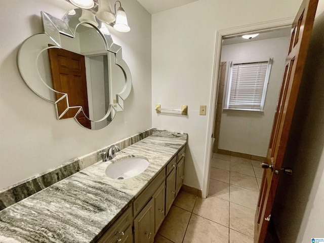 bathroom featuring tile patterned flooring and vanity