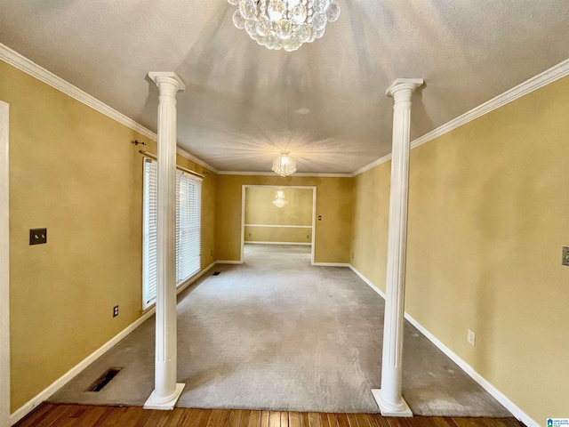 interior space with hardwood / wood-style flooring, crown molding, and an inviting chandelier