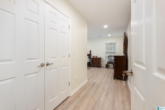 corridor with light wood-type flooring